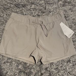 Lululemon on the fly short 2.5” Woven, size 12 in grey sage.